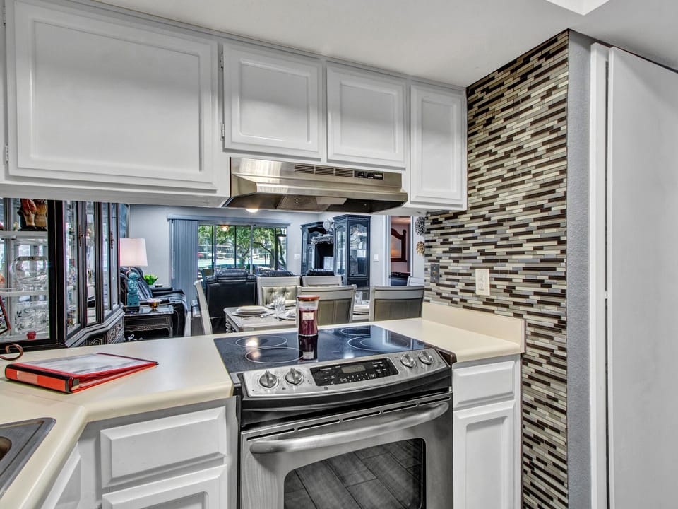 Full-size electric range and oven with fan. Direct serving to dining room table.