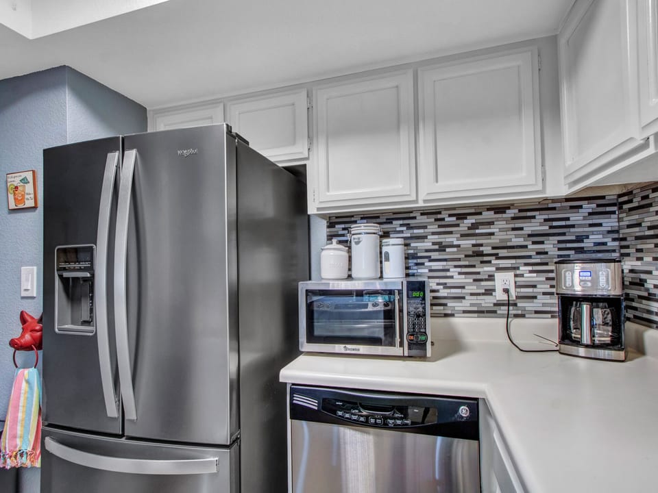 Full-size refrigerator with ice and water dispenser, dishwasher and coffee maker