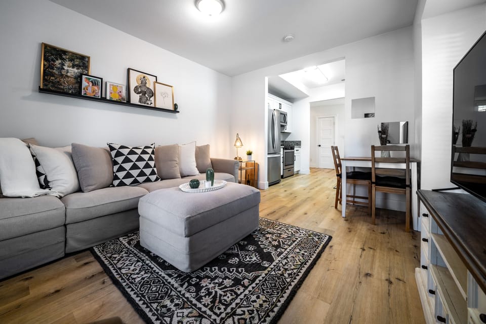 Living room plus corner dining table for two.
