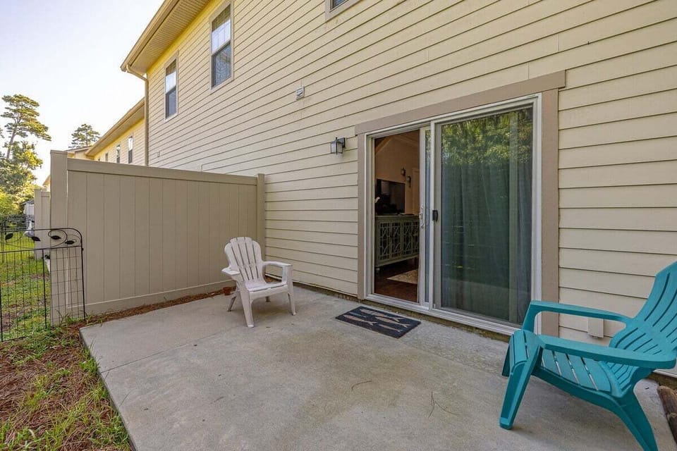 Property patio with sliding door and chairs