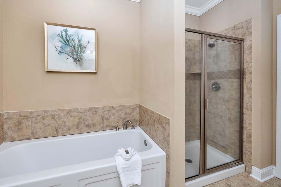Bathroom with soaking tub and tiled walk-in shower