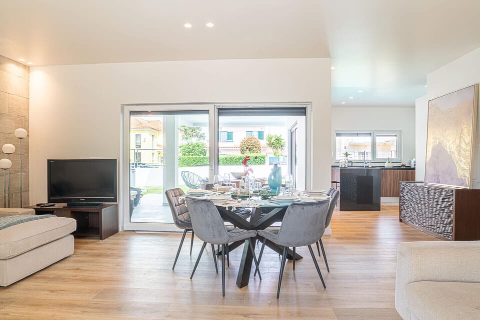 Bright open-plan living and dining area with glass doors — Villa Cuca, luxury holiday villa in Marisol
