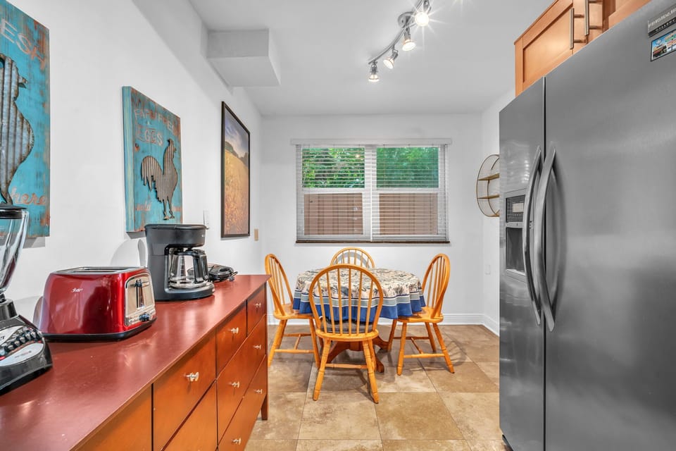 The kitchen also features a full sized refrigerator and several useful appliances for your convenience.
