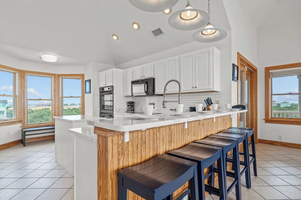 The spacious and well-equipped kitchen gives avid cooks plenty of room to create family-favorite meals.