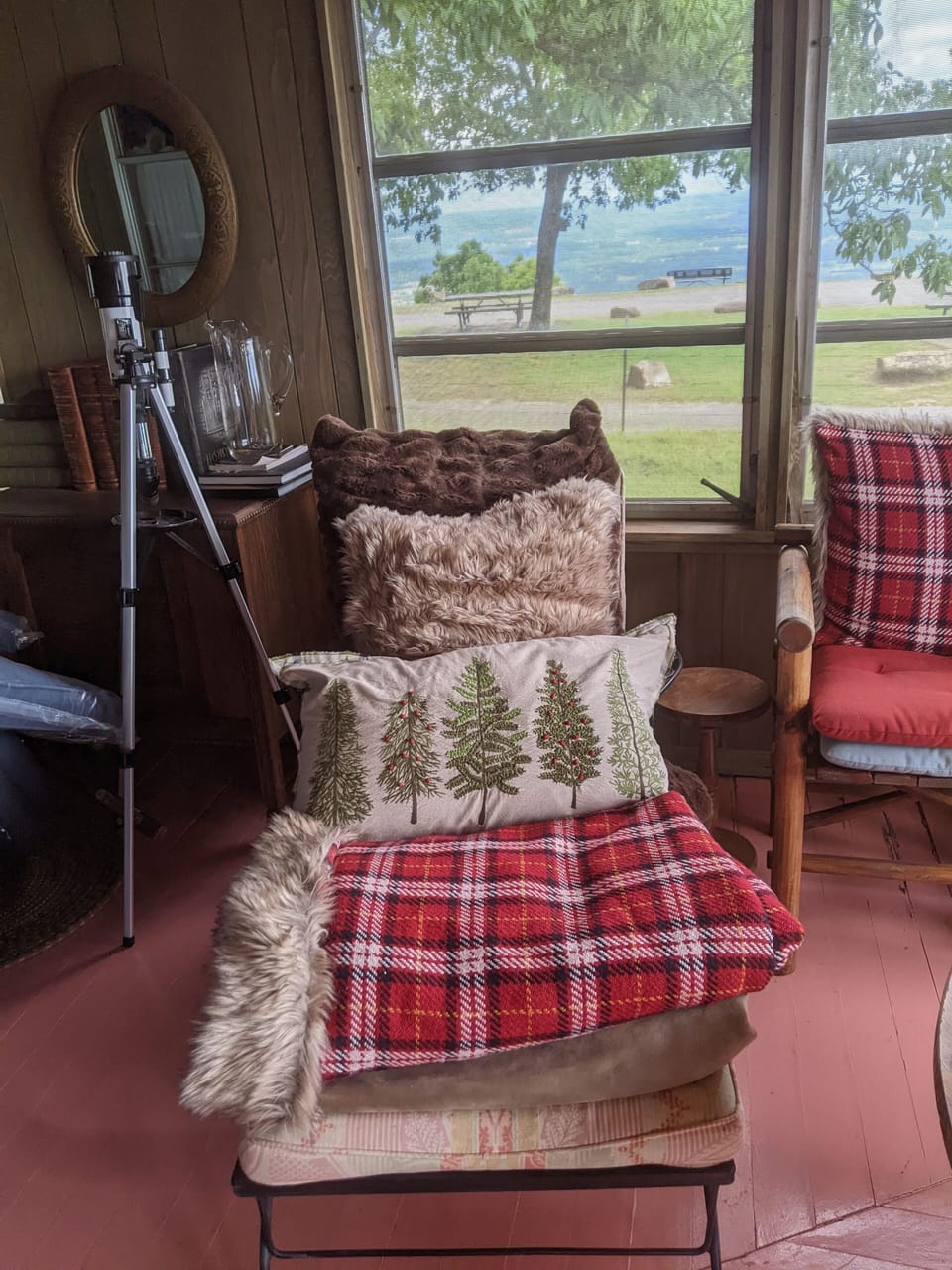 Telescope, games, cushions, beach towels, umbrellas, stored at end of den.