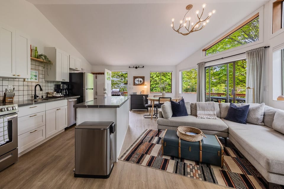 Spacious living area featuring large windows and plenty of sunshine.