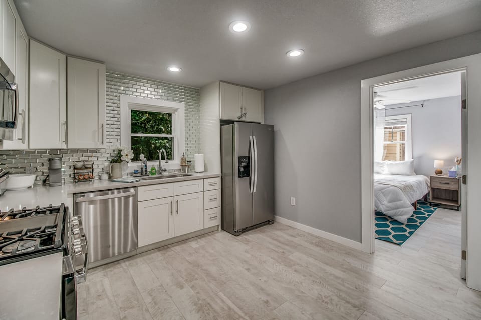 Kitchen is equipped with Dishwasher, Refrigerator and Gas Stove.
