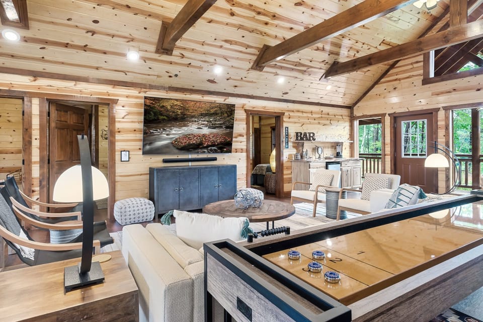 Upper game room/living space with huge 86" TV, Sonos, Bar, foosball and more 