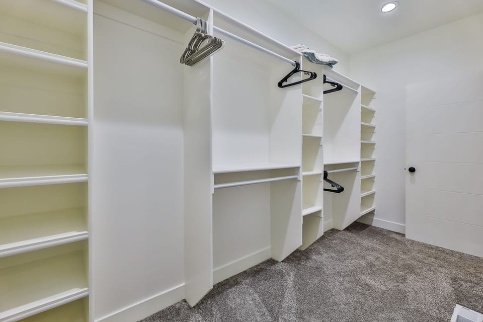 Walk-in closet with plenty of space for his/her wardrobe