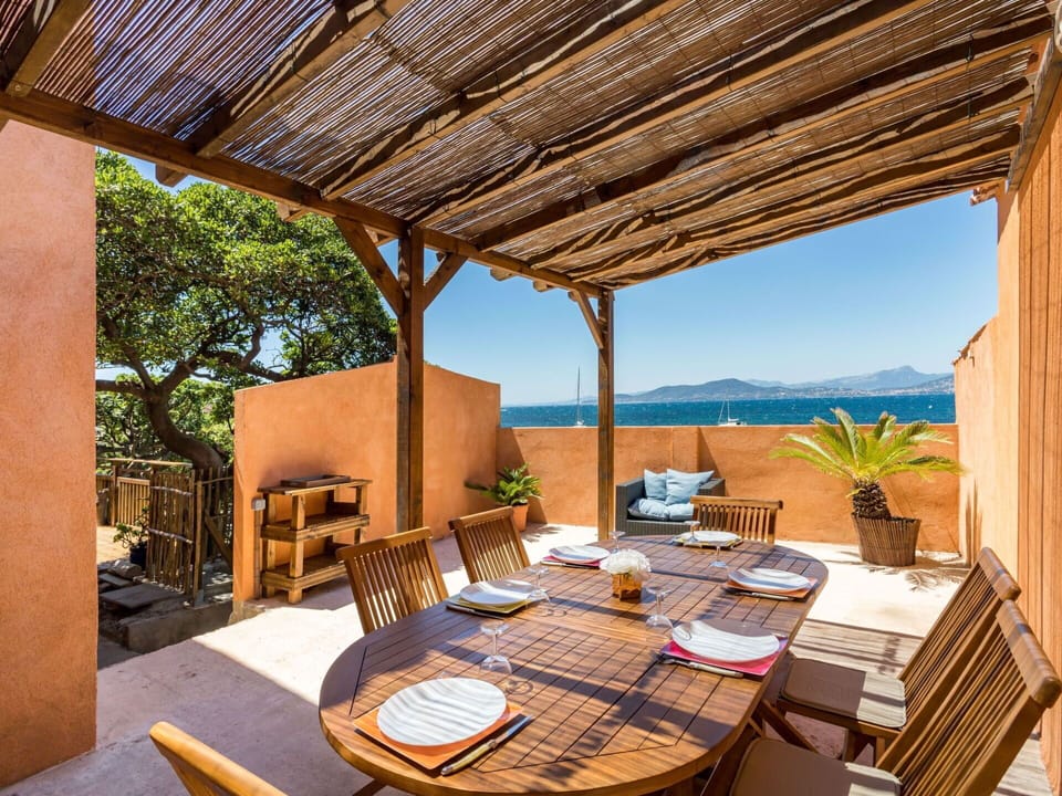 Table, Property, Furniture, Sky, Chair, Shade, Interior Design, Outdoor Furniture, Wood, Lighting