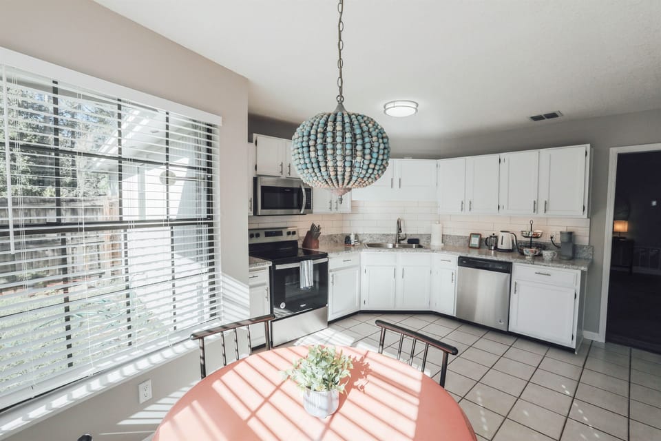 Let there be light! You'll love cooking in this bright and airy kitchen. Fully stocked with all cookware, air frier, crock pot, blender, mixer, toaster and spices.
