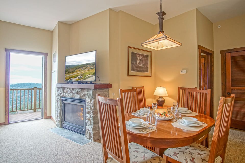 Dine in comfort beside the fireplace, where warmth and ambiance come together.