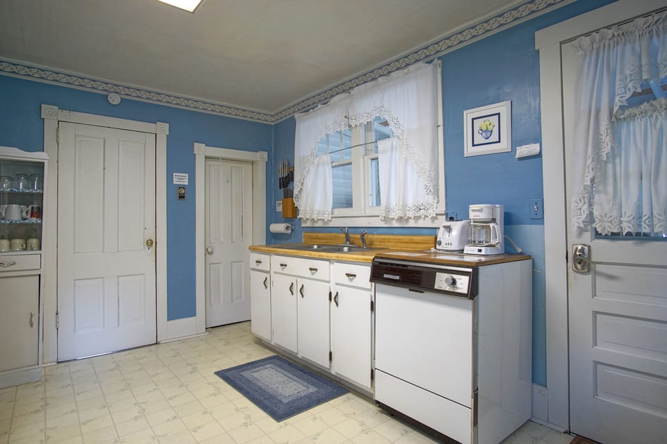 Intimate and character-rich, this kitchen offers an authentic glimpse into the home's earlier days. Note: Dishwasher has been removed