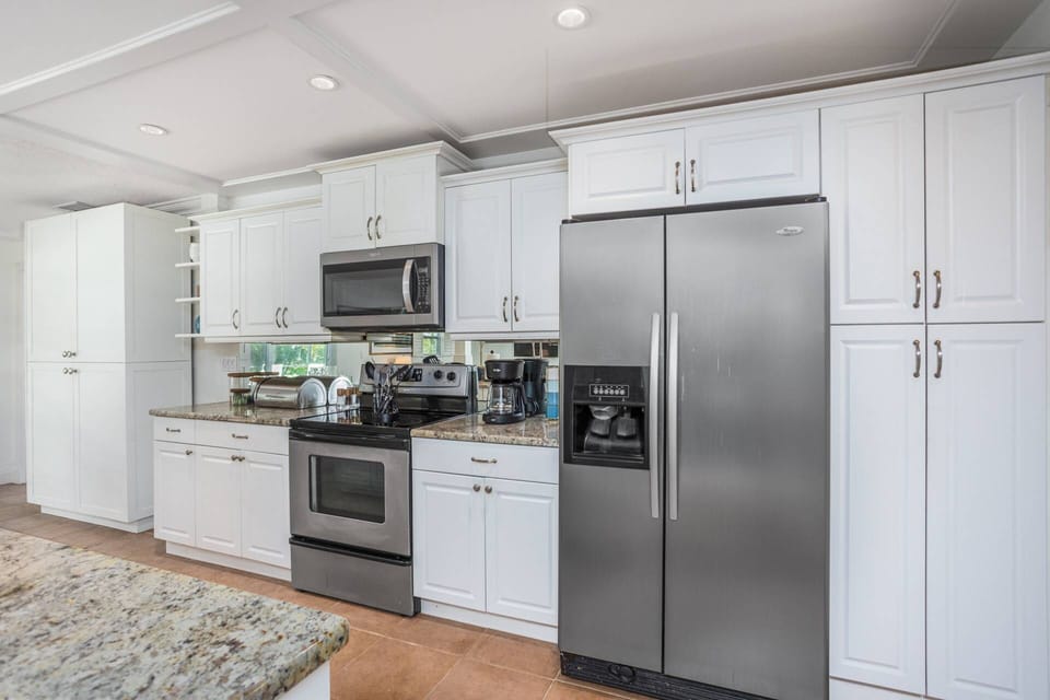 Feel at home cheffing in the spacious kitchen with granite countertops and stainless appliances.