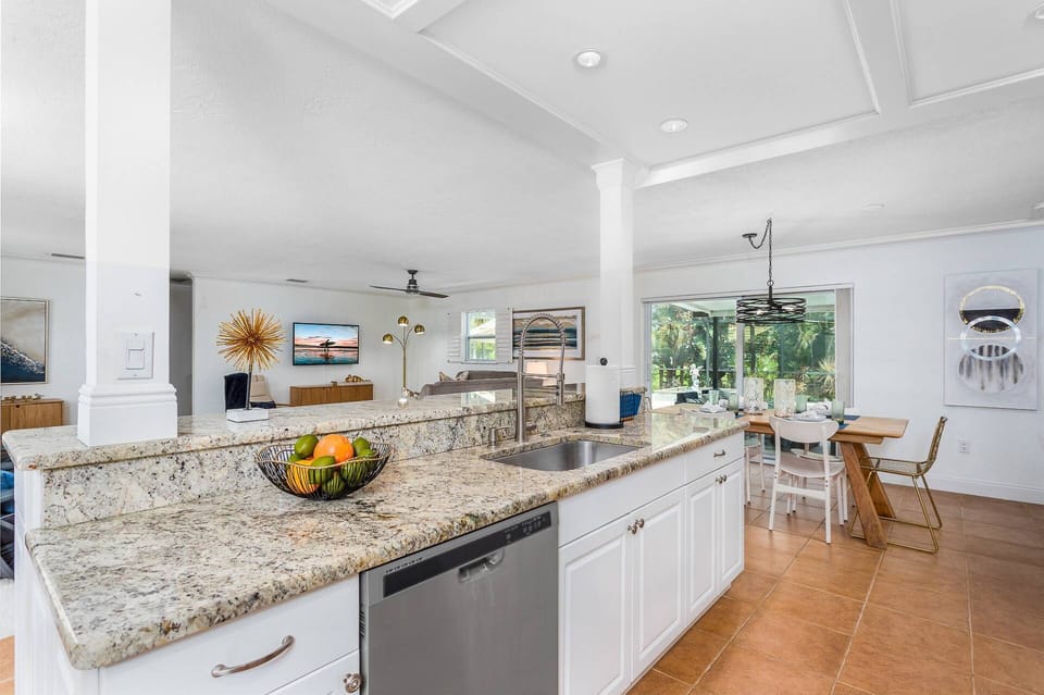 Open kitchen to everything!  Updated with stainless appliances...stocked with plenty of dishes & cookware