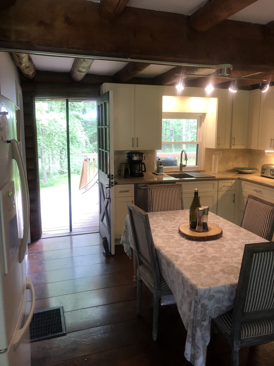Walk through kitchen from front porch to back porch