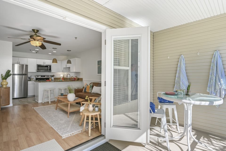 Step into your bright open-plan retreat where coastal charm meets modern comfort, complete with a private porch for morning coffee.