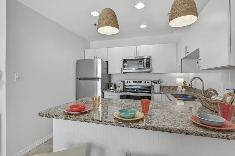 Your fully equipped kitchen features granite counters, stainless appliances, and everything you need to create memorable meals during your stay.