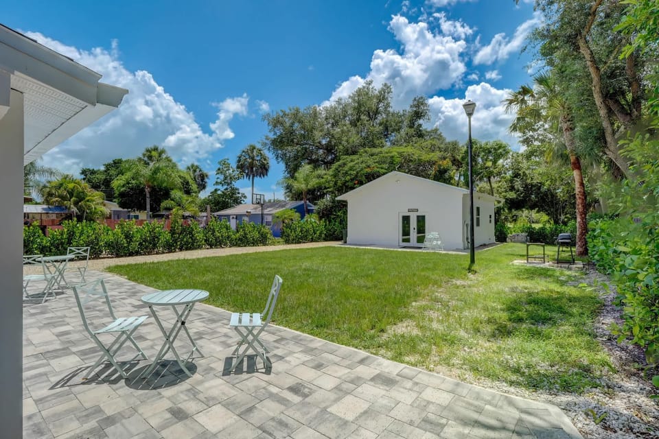 The Studio Has a Patio with a Set of Chairs and a Table Just Outside
