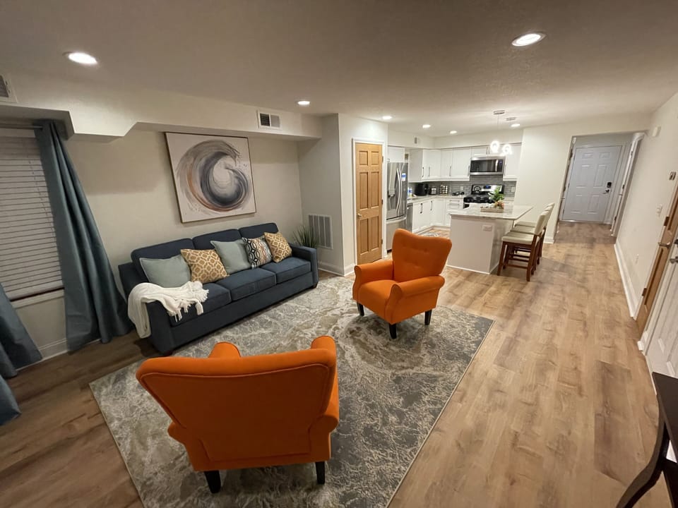 Open-concept Living/Dining/Kitchen area with pull-out sofa w/ queen size bed.
