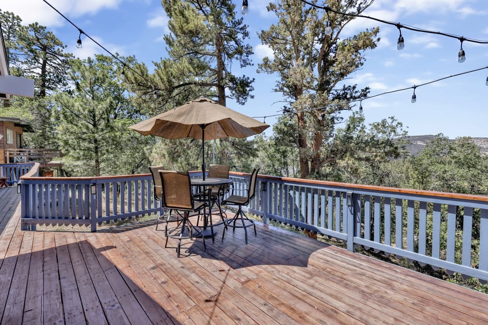 Inviting patio featuring string lights, outdoor seating, and scenic views for gatherings under the stars
