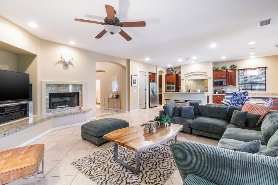 The living area features a fireplace and a TV.