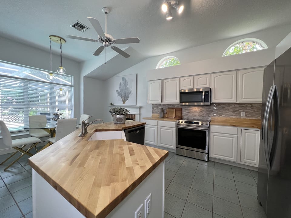 Stainless steel appliances in the well equipped kitchen- even an airfryer