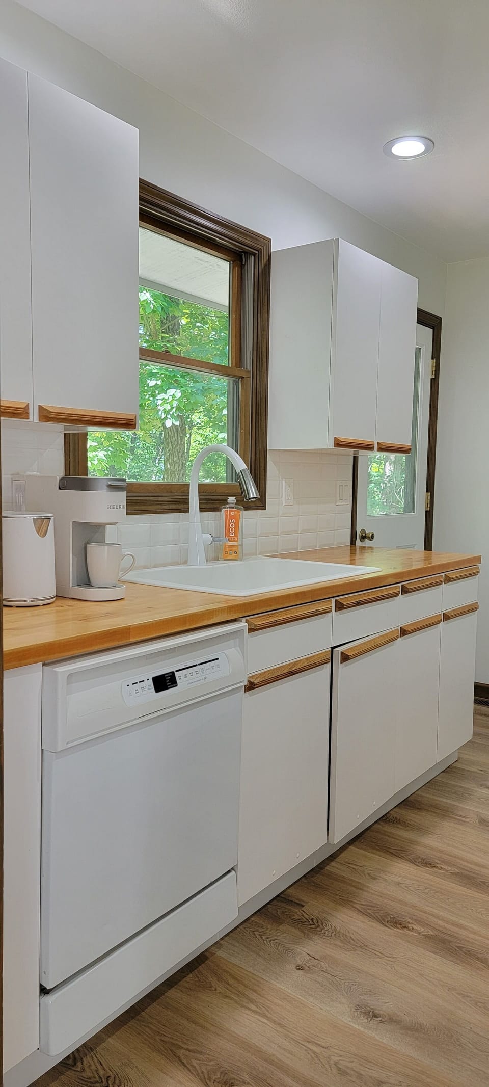 very spacious kitchen with lots of coffee and sweeteners to get your day started
