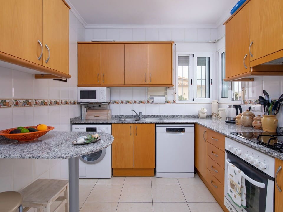 Countertop, Cabinetry, Kitchen Appliance, Building, Kitchen Stove, Sink, Kitchen, Home Appliance, Wood, Interior Design