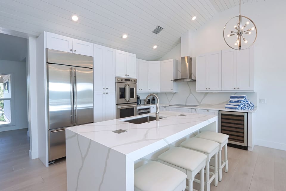 Chef's Kitchen Island with hidden electrical plugs for small kitchen appliances