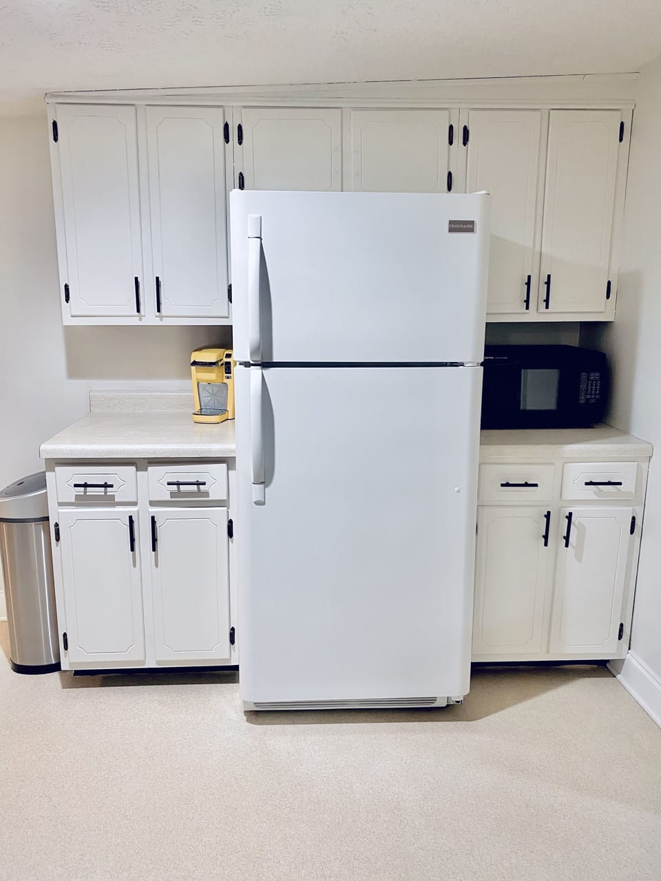 Keurig, and microwave. Coffee, sugar and creamer in cabinet up above Keurig. 