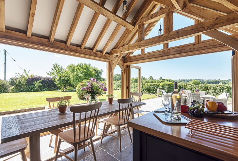 Hilltop Cottage, Wimborne: The bi-folding doors allow the kitchen and dining area to fully connect to the wonderful garden