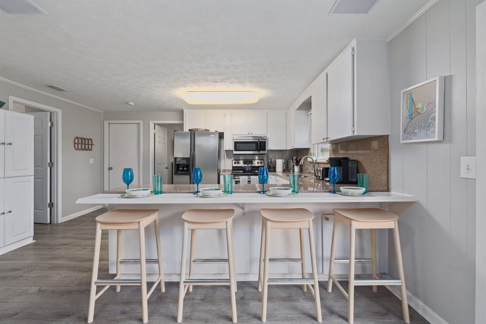 Cookware, flatware, dishes, glasses, utensils, cutlery, Keurig and regular coffee maker provided