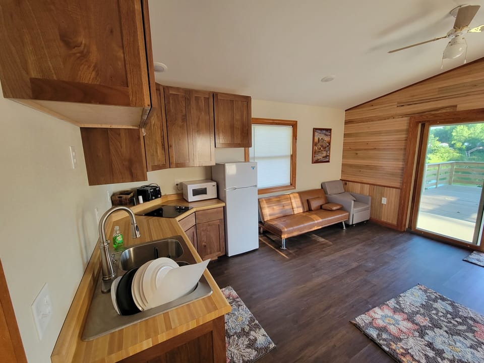 Main room, Kitchen, futon and chairs