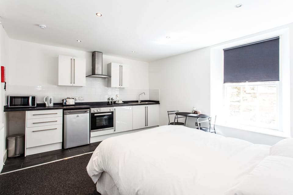 A spacious private room featuring a fully equipped private kitchen for your comfort and convenience.