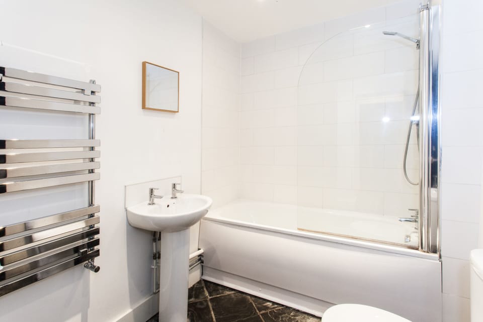 Shared bathroom facilities available for guest use, offering a practical and communal experience during your stay.