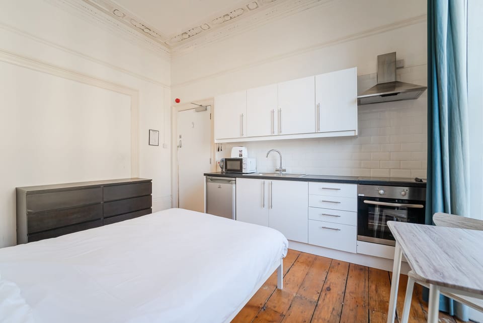 A spacious private room featuring a fully equipped private kitchen for your comfort and convenience.