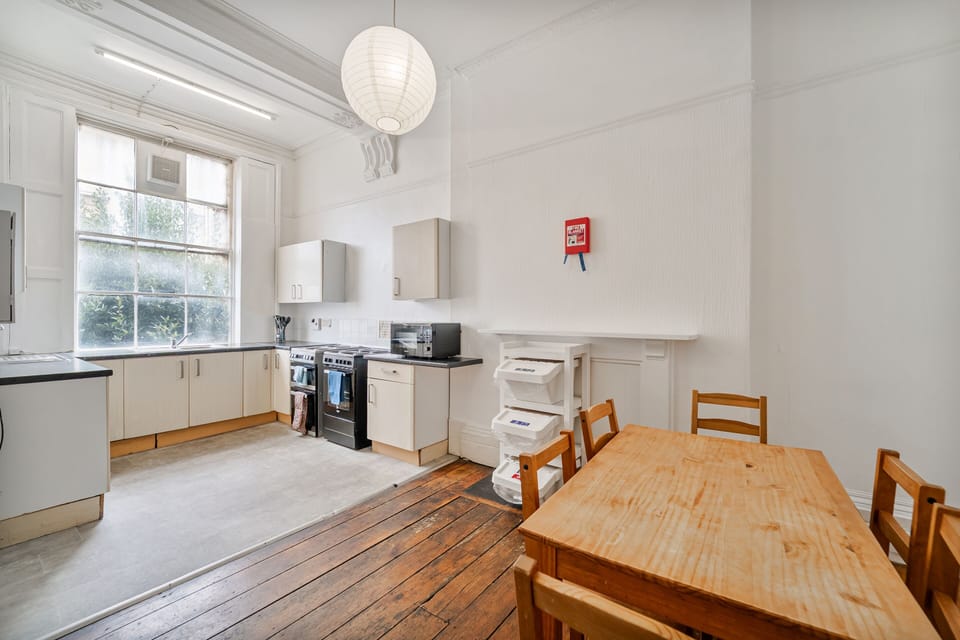 Shared communal kitchen for guests to enjoy and prepare meals together.