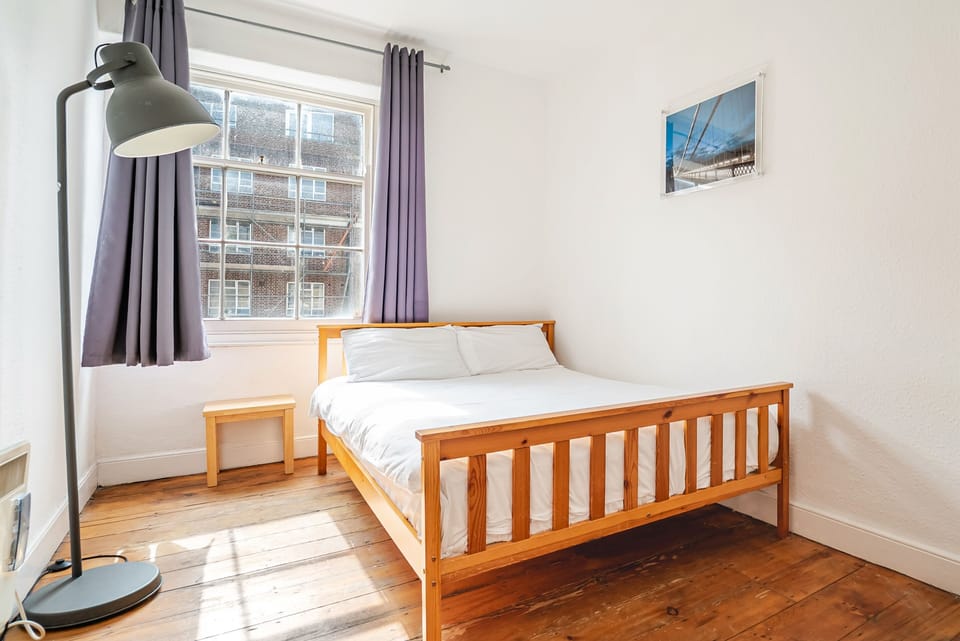 A cosy private bedroom filled with natural light, offering a bright and inviting space for restful stays.
