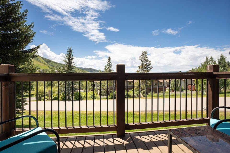 Step onto your private deck where mountain vistas and fresh alpine air create the perfect morning coffee sanctuary.
