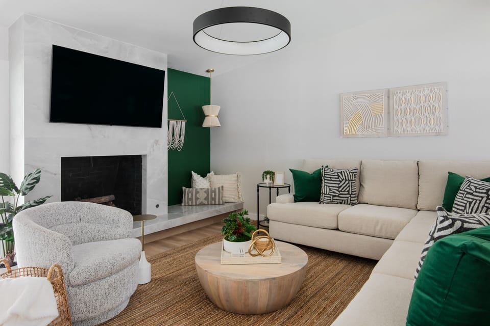 Living room space with HD TV and plenty of seating.