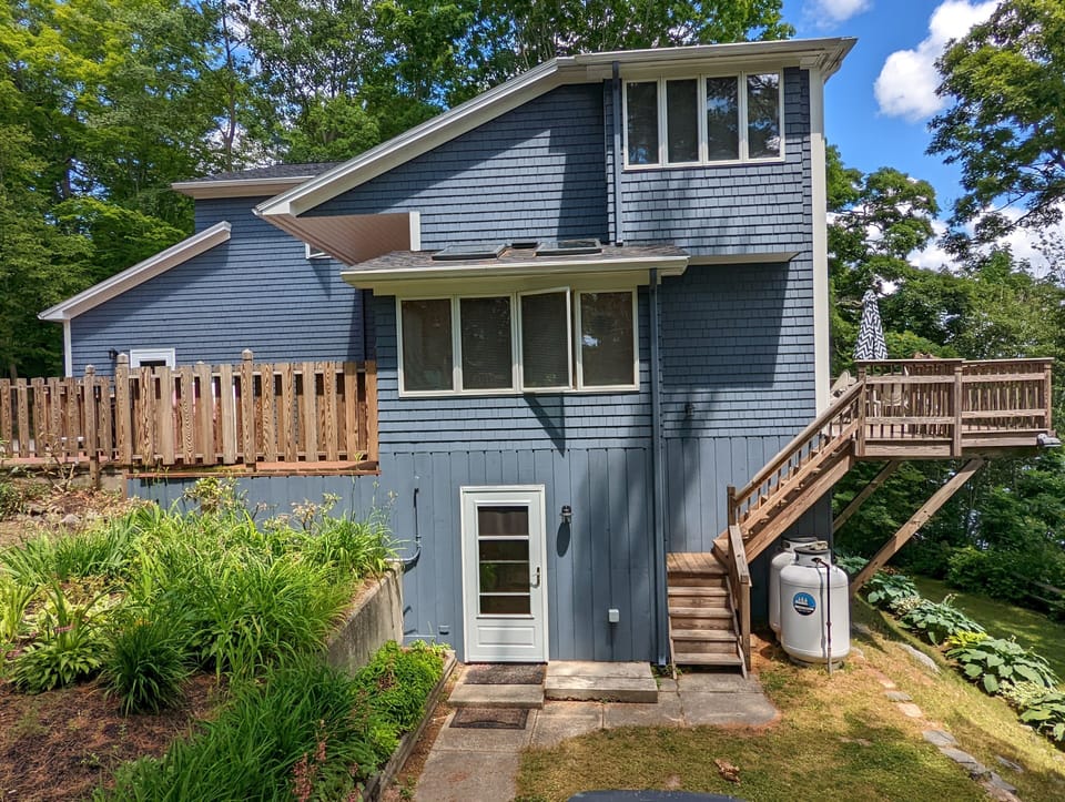 Here is a side view of Highview with pictures of the back deck and front patio.