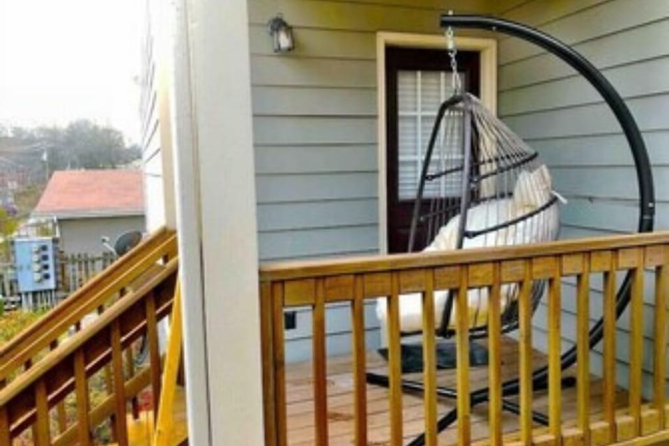 Our side porch boasting a comfortable egg swing!