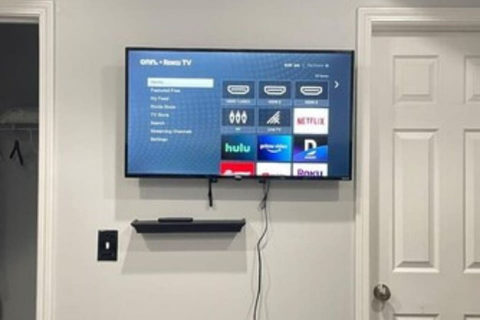 Unwind in the Master bedroom equipped with a Smart Roku TV for your movie nights