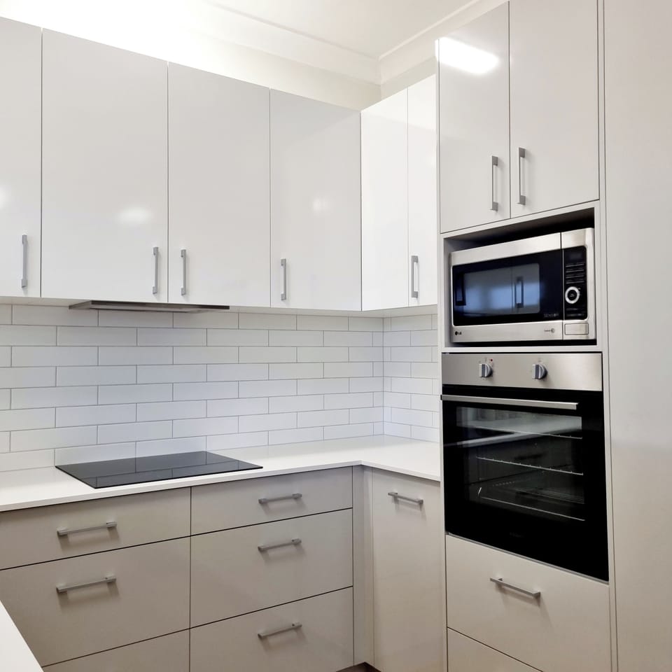 Full kitchen including induction cook top, oven and microwave