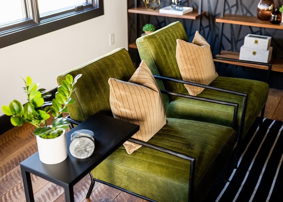 Unit 1: Extremely detailed spacious living area with designer luxury furnishings, 85 in flat screen TV, flooring from a 150 year old barn, custom murals/wall art, light fixtures and wall paper.