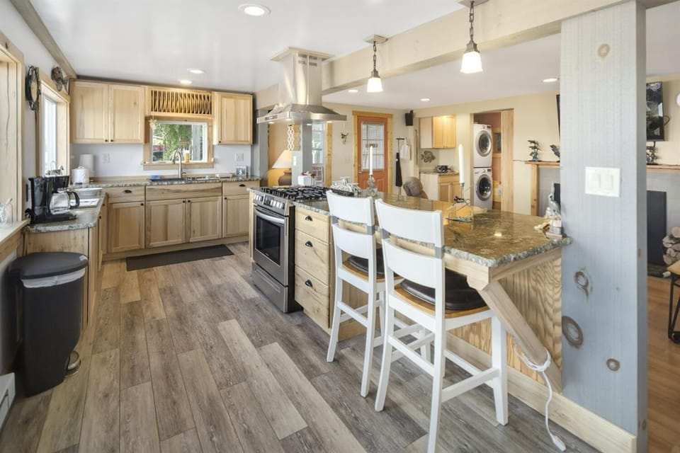 Updated kitchen with spacious island and unbeatable lake views.