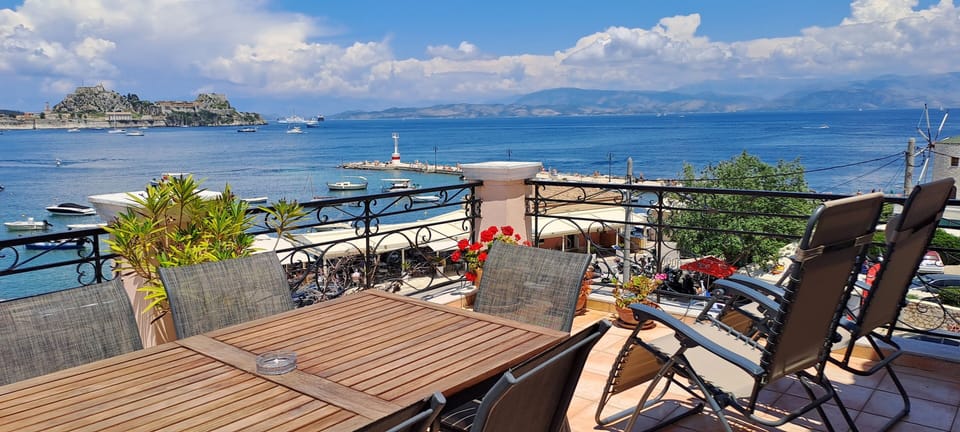 LARGE VERANDA WITH A VIEW OF THE OLD FORTRESS OF CORFU
