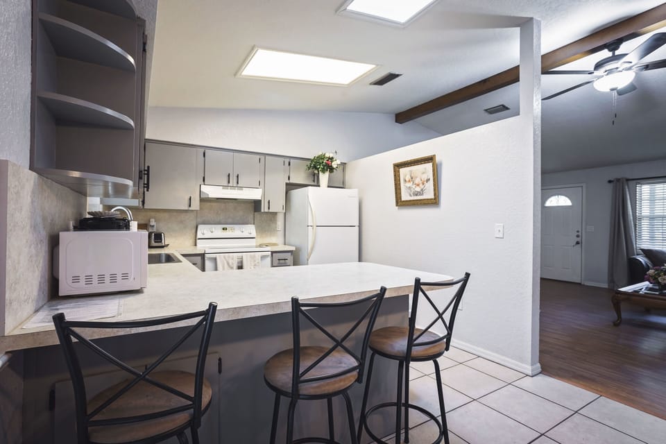 kitchen counter top with stools