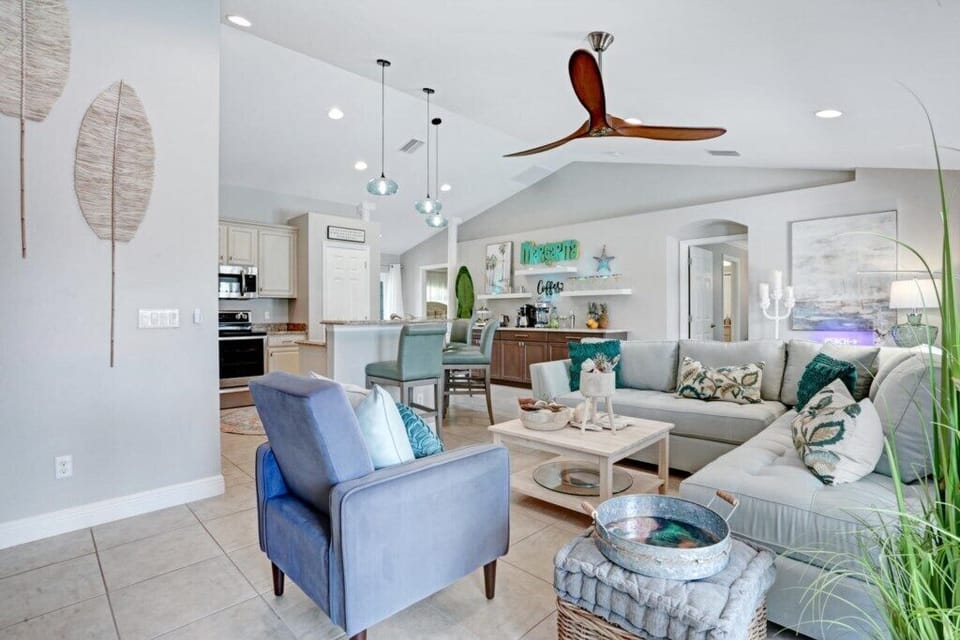 Open-concept living room with modern decor and cozy seating, perfect for relaxation and entertaining